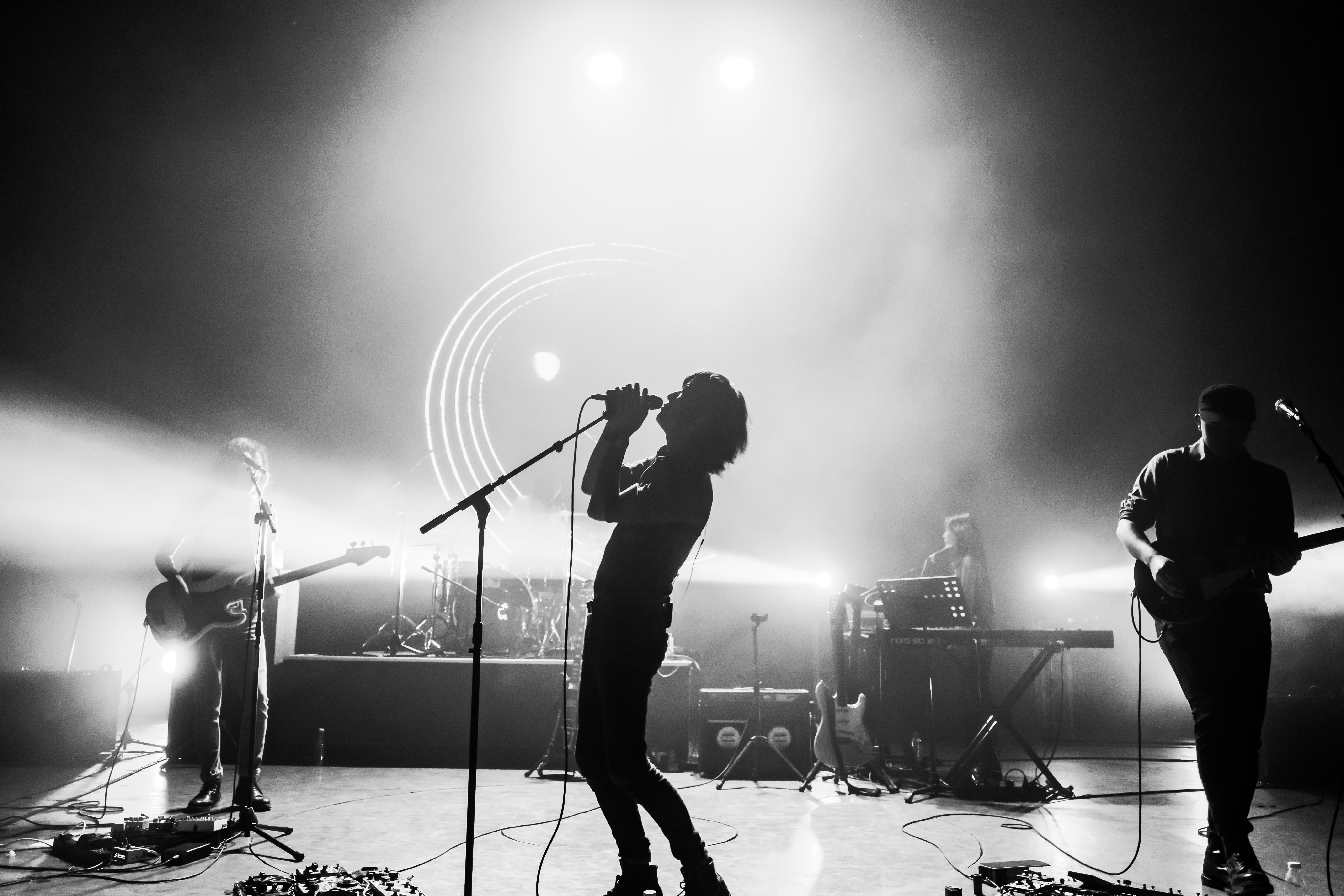 band on stage black and white image