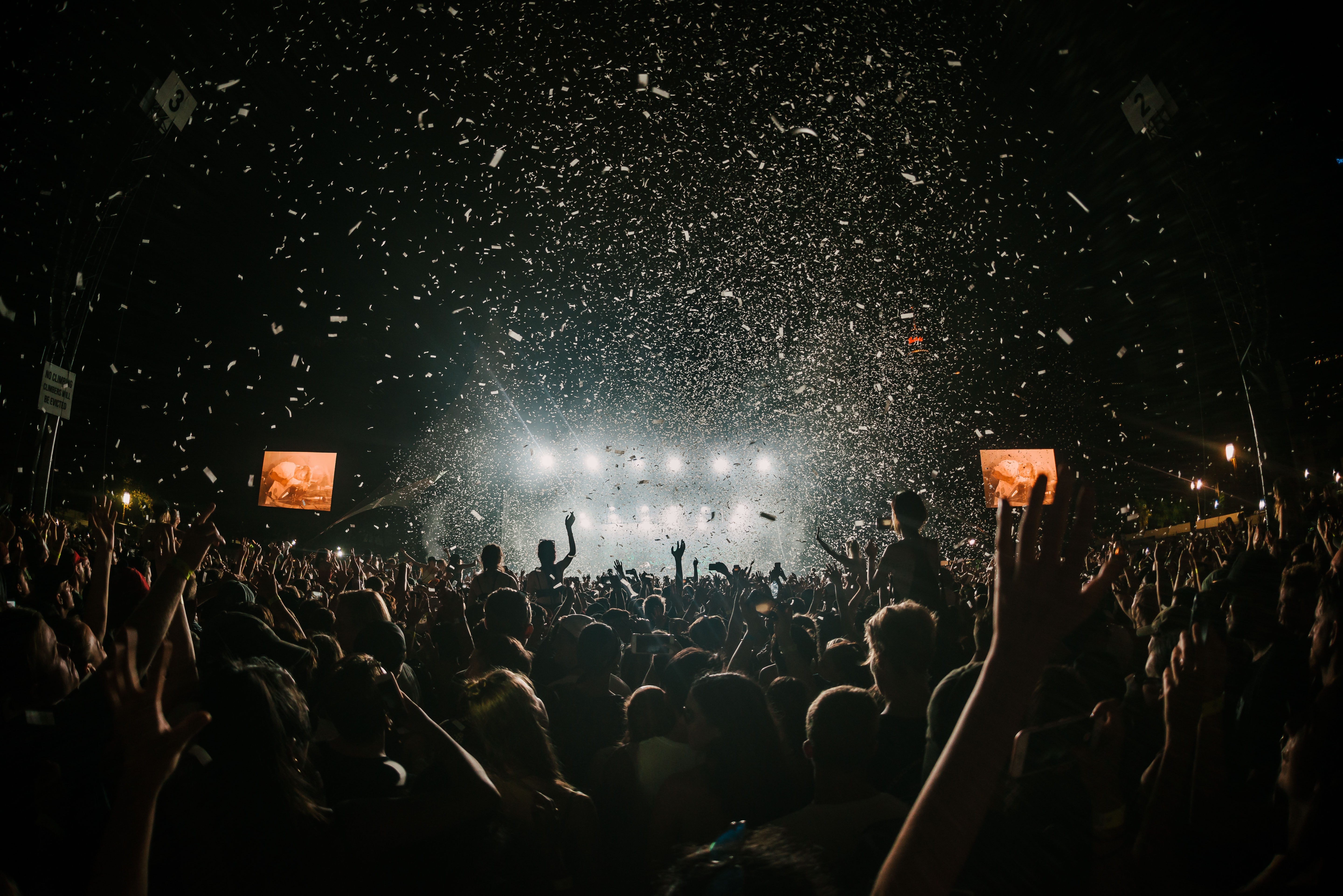 lights and confetti view of a concert stage and from audience view